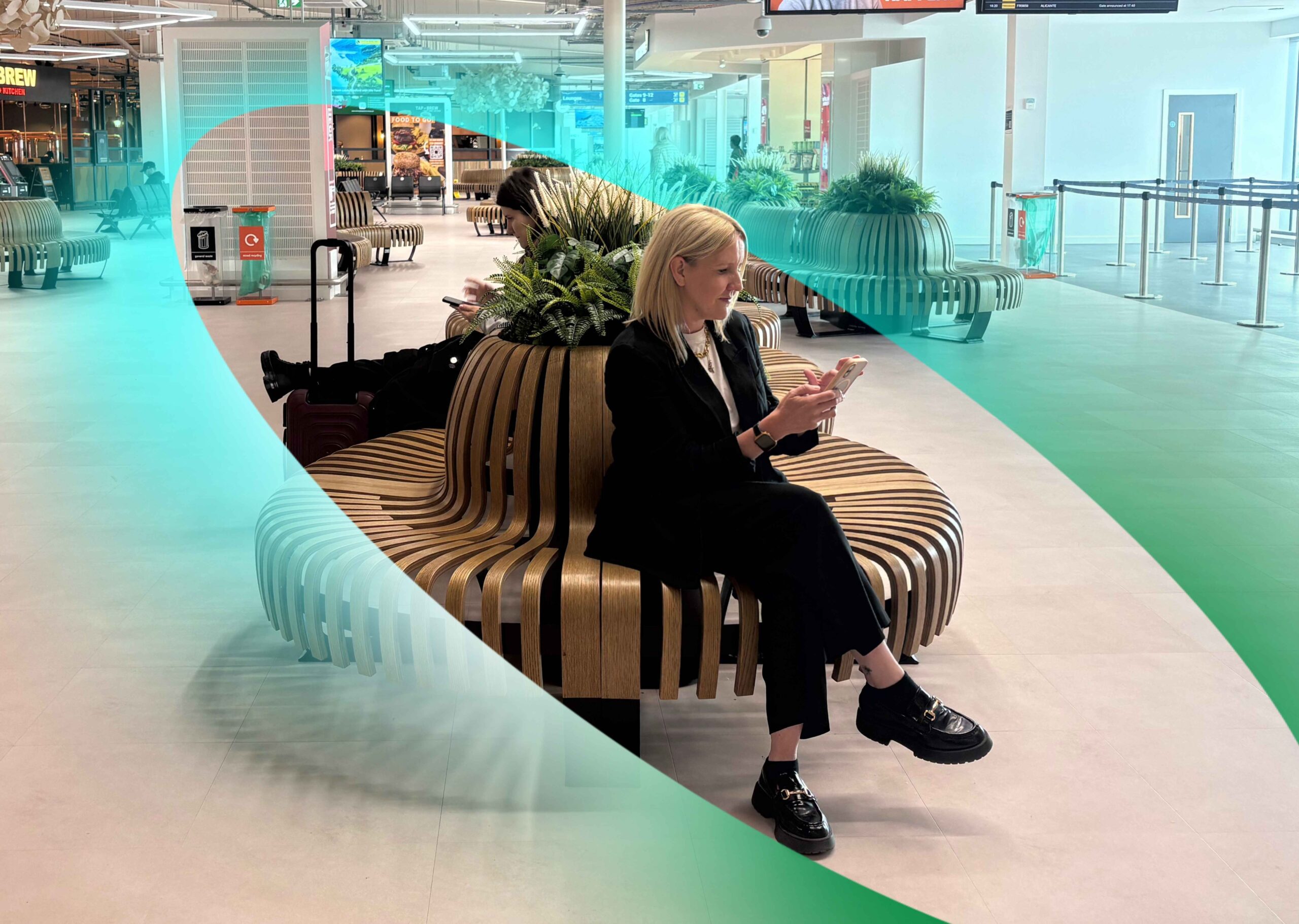 person at an airport using a mobile phone surrounded by the Freshwave connectivity orb.